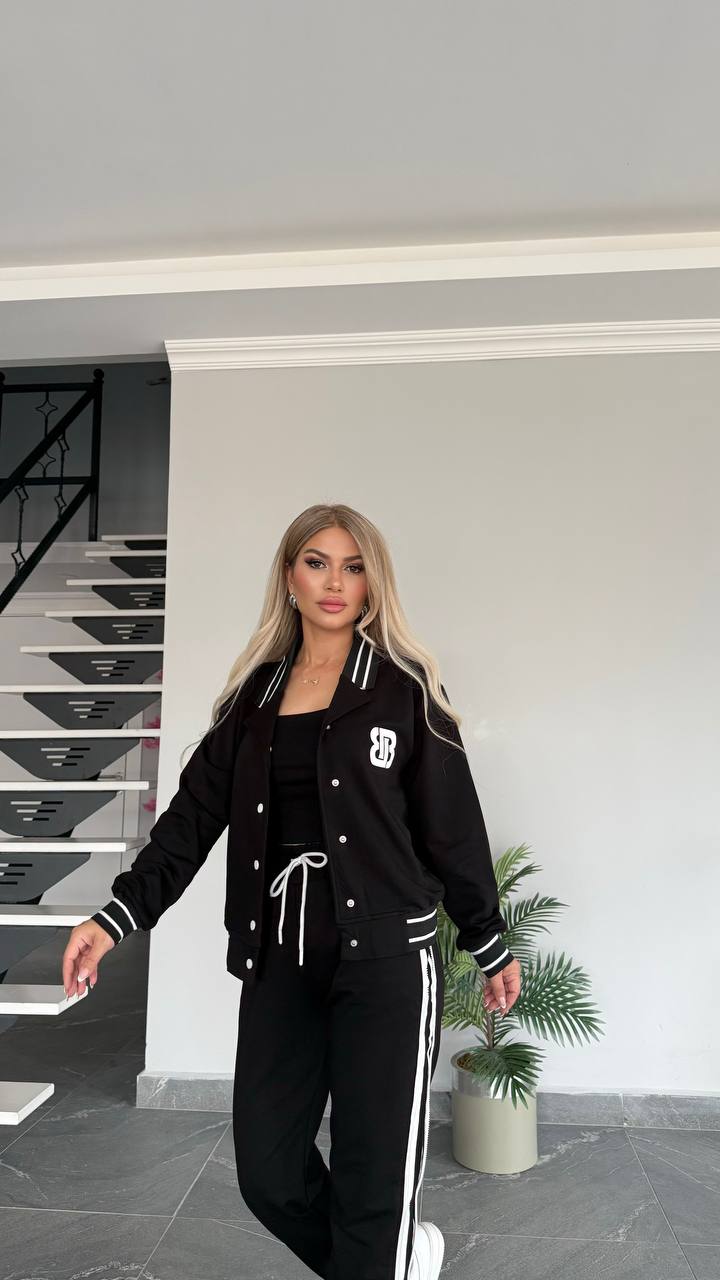 Style with this chic black varsity jacket set